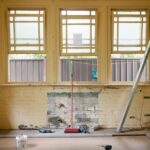 Yellow brick Kitchen with three windows being Renovated